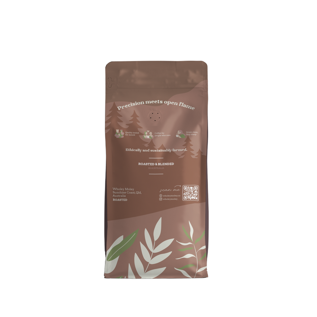 Wholey Moley coffee bag back with leaf design on a white background