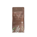Wholey Moley coffee bag back with leaf design on a white background