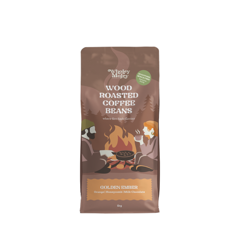 A 1kg bag of Wholey Moley Wood Roasted Coffee Beans, Golden Ember flavor, shown on a plain white background.